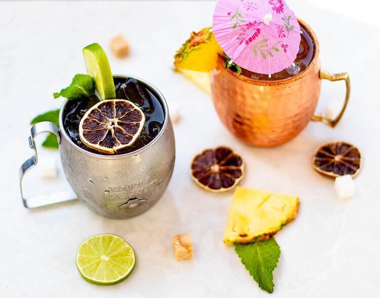 Copper mug cocktails with citrus garnish