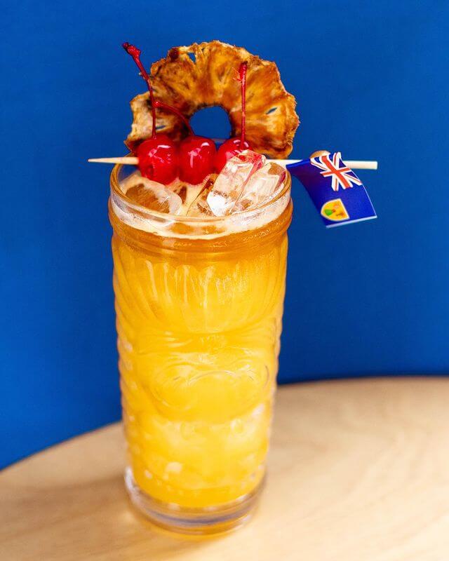 Tropical cocktail with an orange garnish